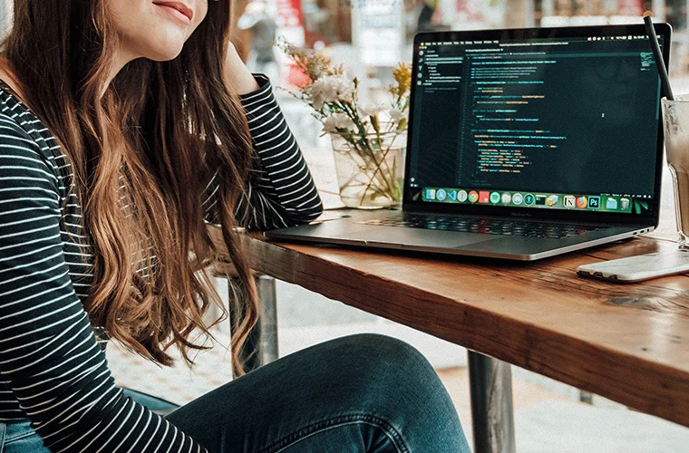woman-coding-website-on-laptop